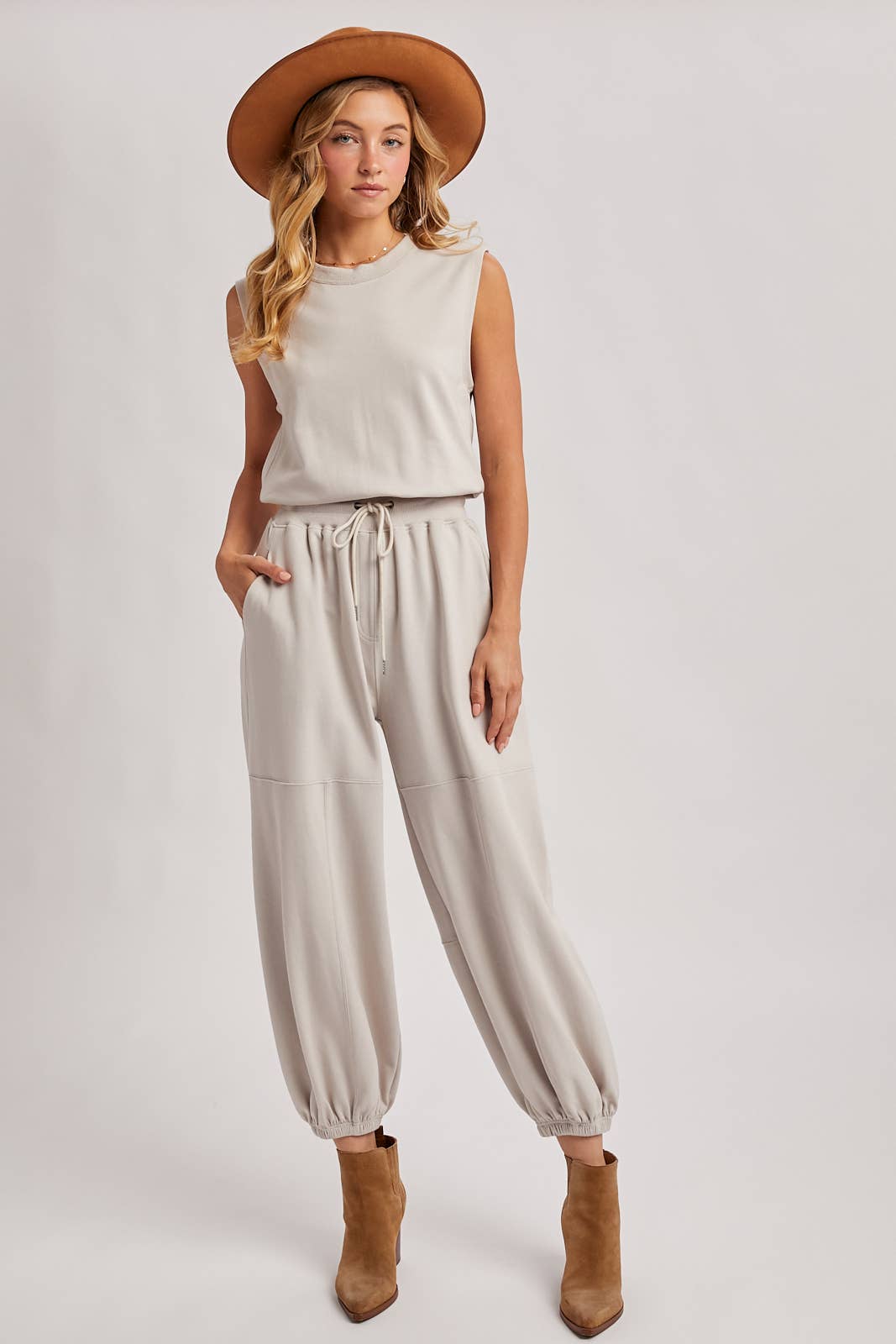 DRAWSTRING WAIST SLEEVELESS KNIT ACTIVE JUMPSUIT: ASH