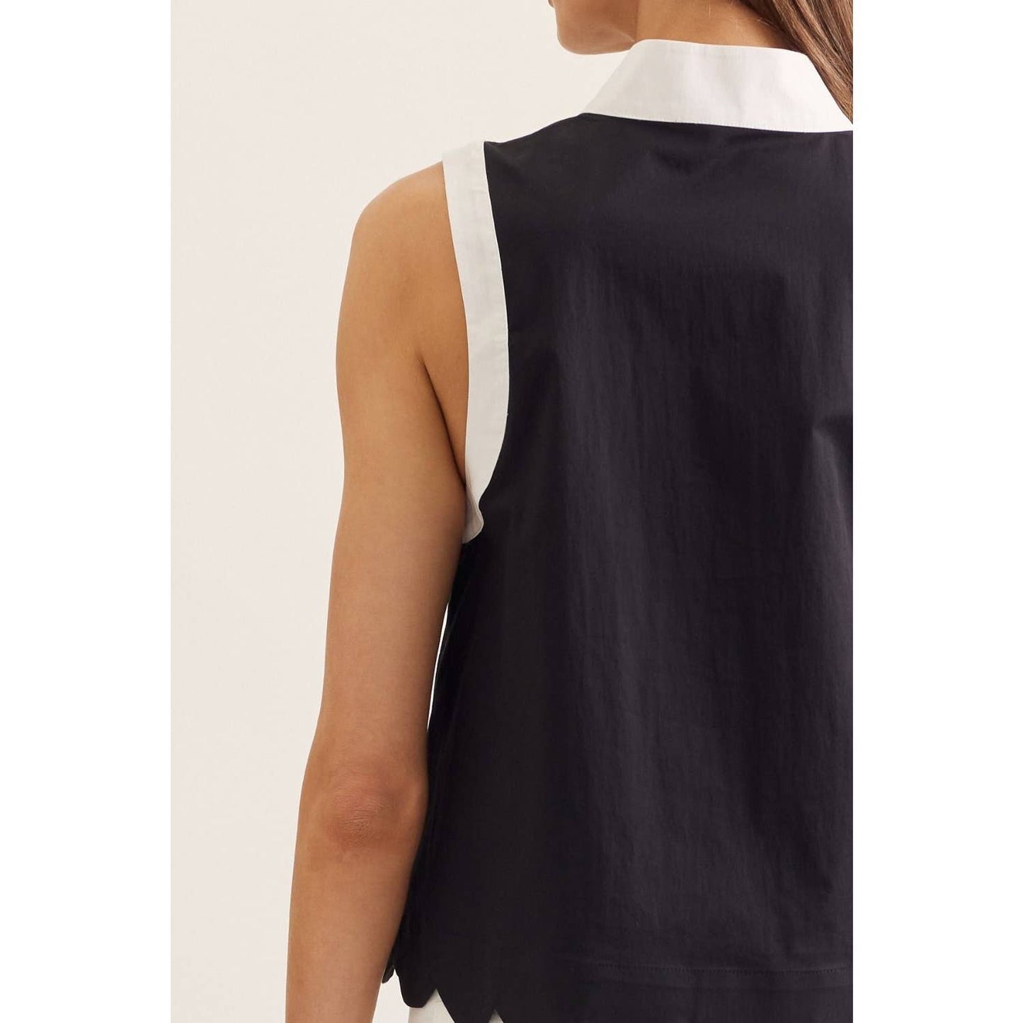 Solid sleeveless top: BLACK