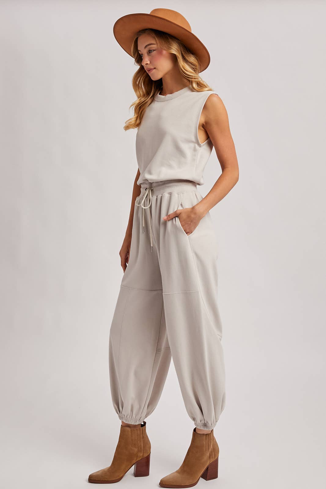 DRAWSTRING WAIST SLEEVELESS KNIT ACTIVE JUMPSUIT: ASH