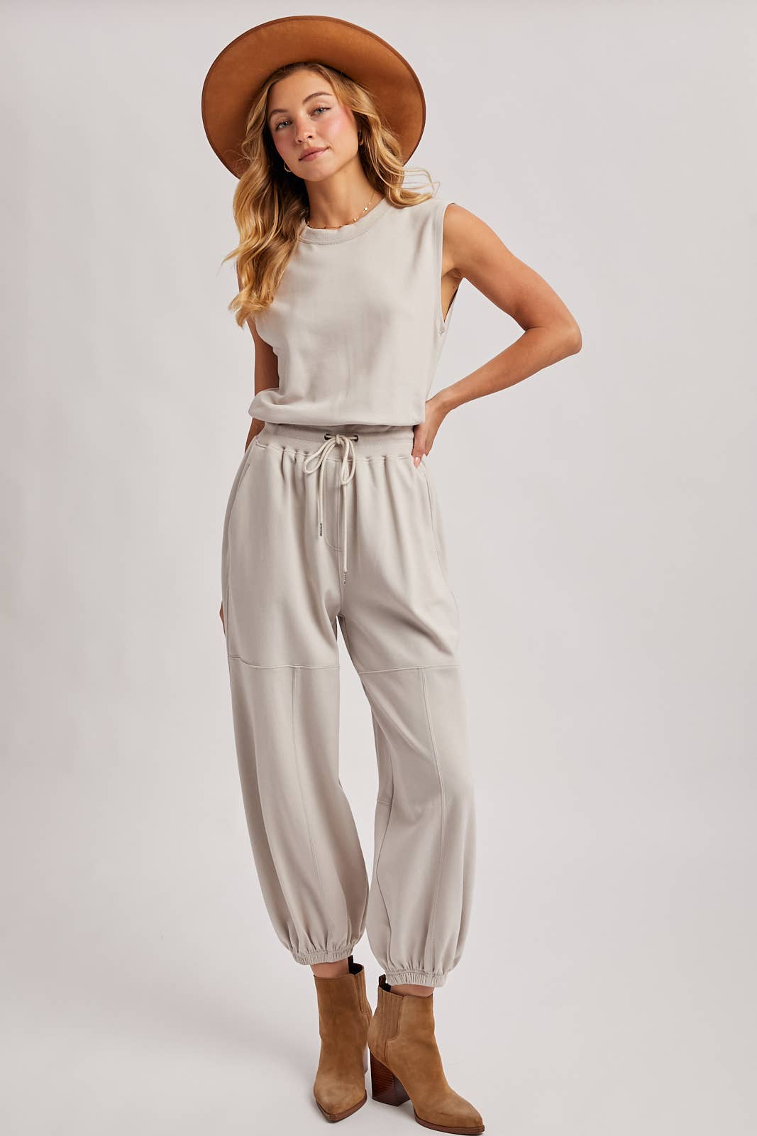 DRAWSTRING WAIST SLEEVELESS KNIT ACTIVE JUMPSUIT: ASH